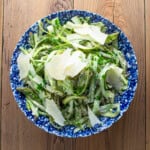 shaved asparagus in a creamy dressing garnished with parmesan shavings.