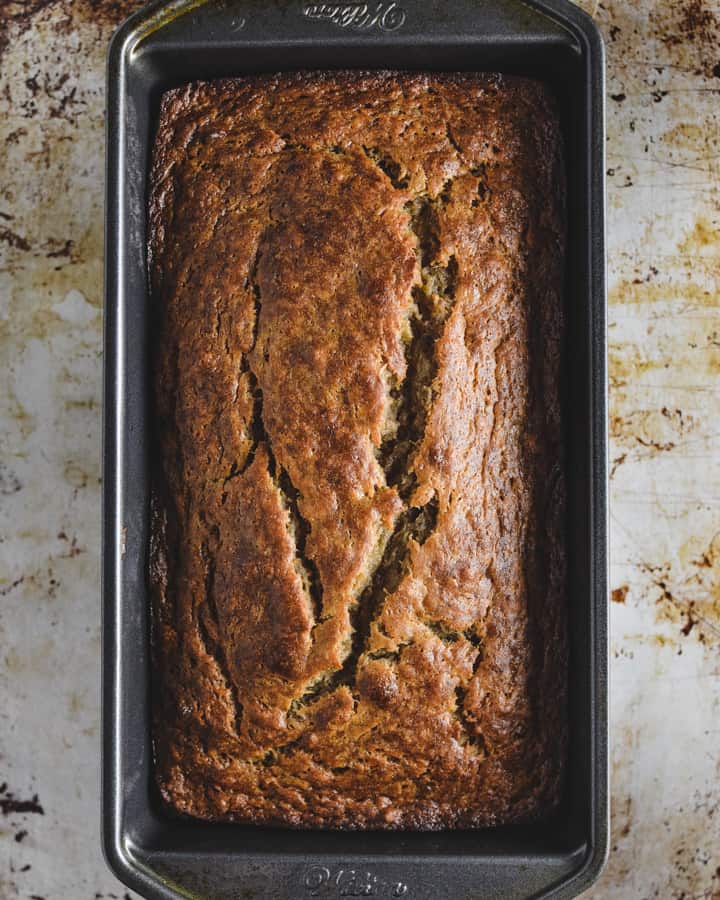 banana bread loaf in pan on a tray