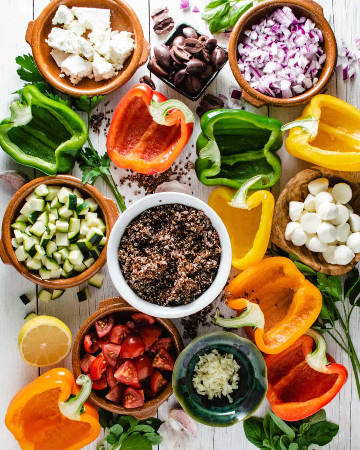 Raw ingredients for stuffed peppers laid out on a table.