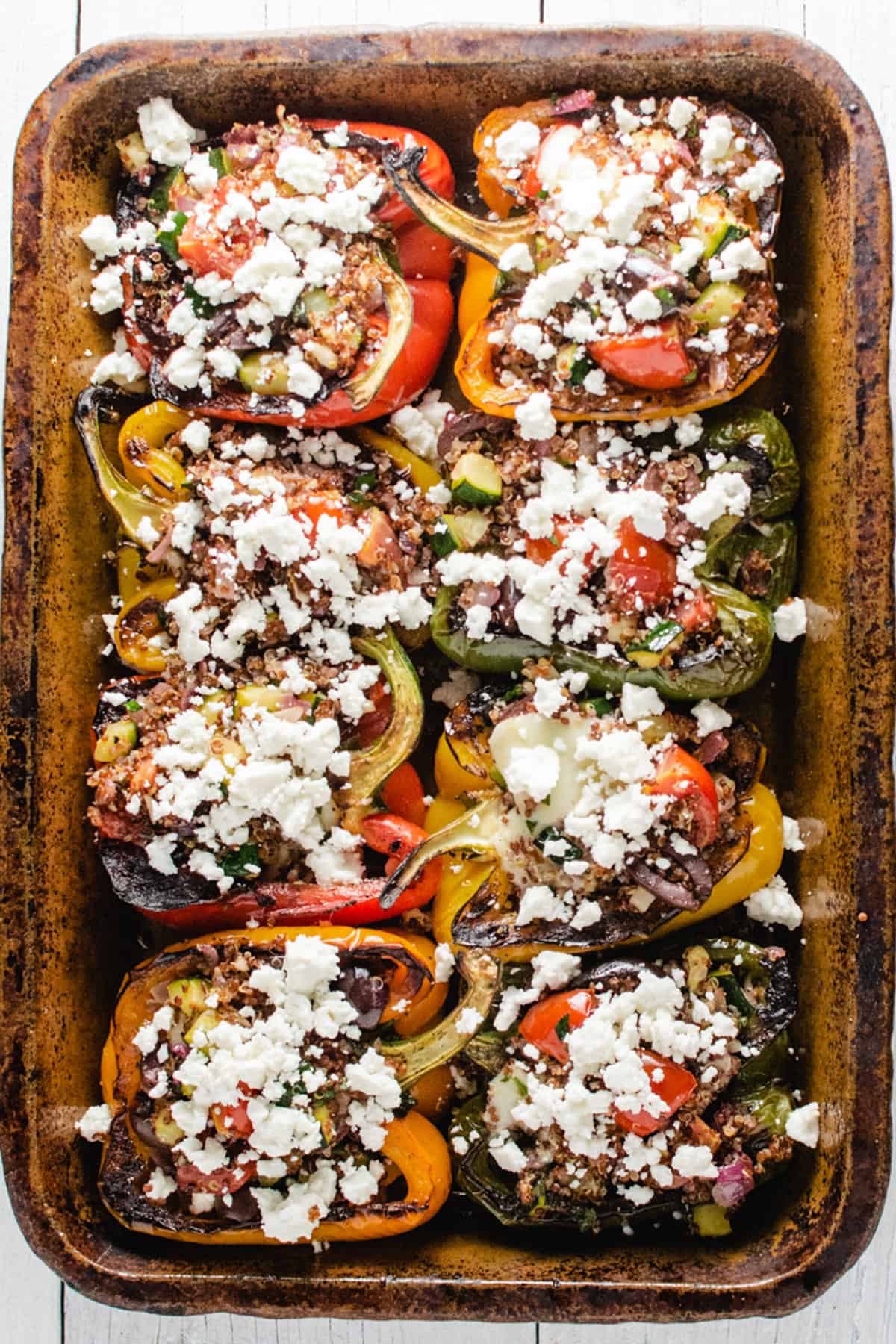 8 pepper halves stuffed with quinoa filling and topped with feta cheese. 