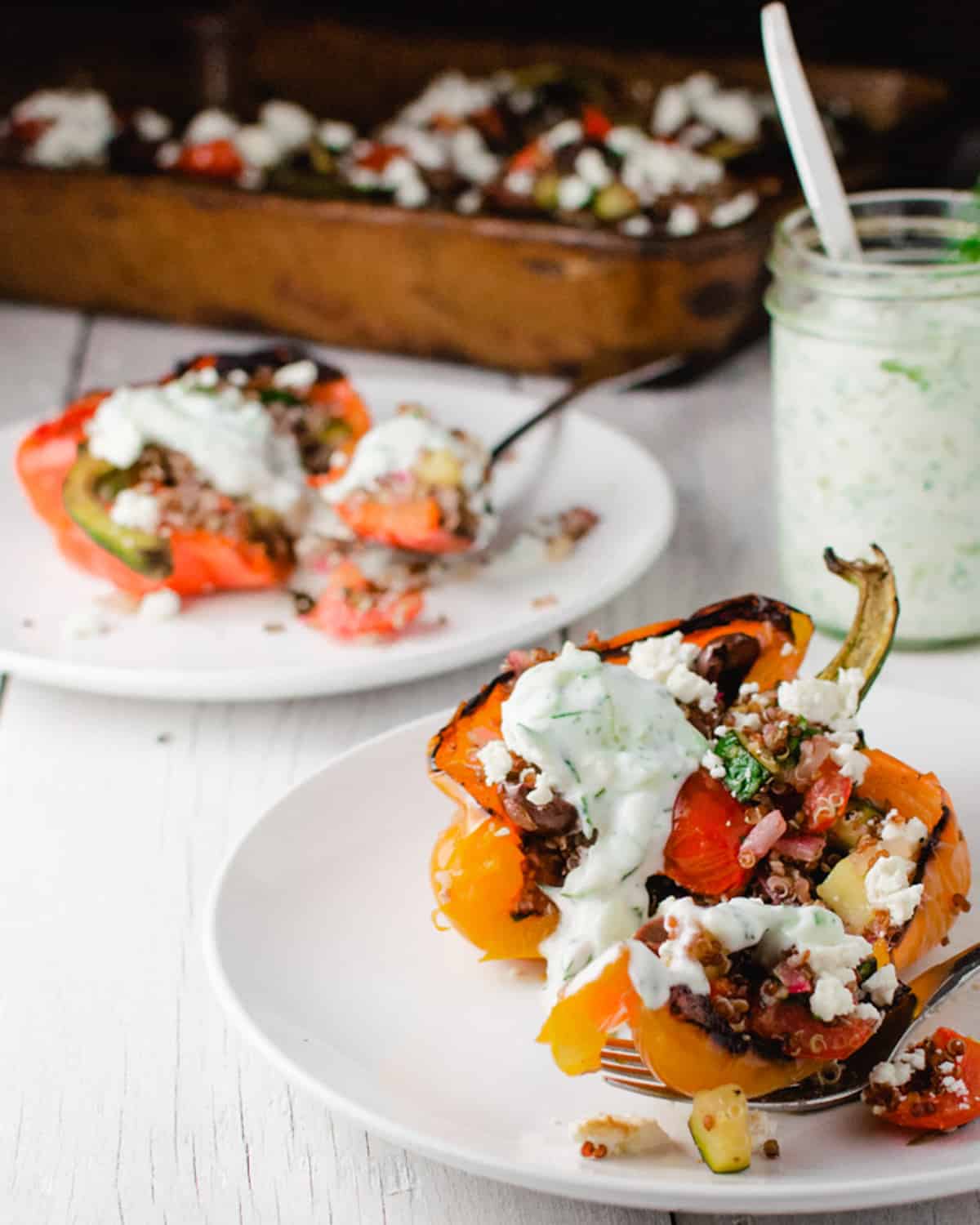 Plated peppers with tzatziki sauce. 