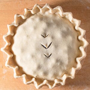 double crust pie with fluted edges before baking.