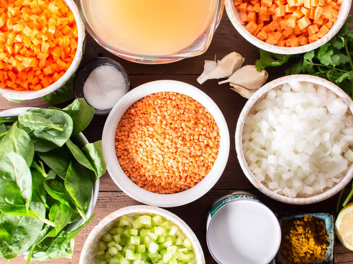 prepped onions, carrots, sweet potato, celery and other ingredients for red lentil and vegetable soup