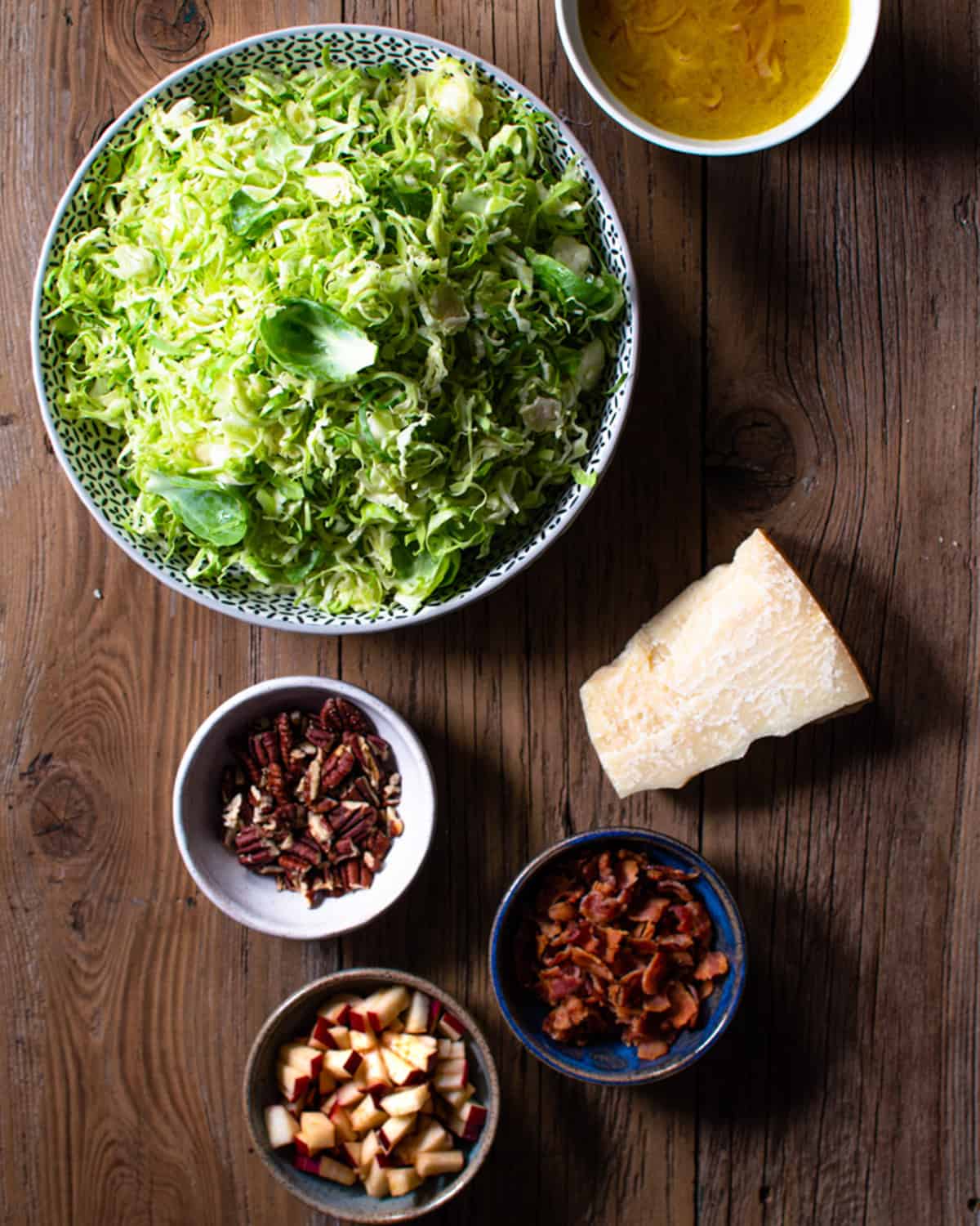 Ingredients for slaw in separate bowls.