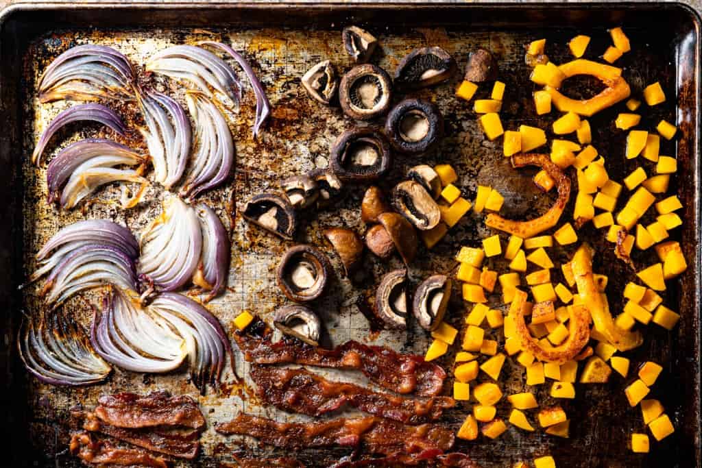 vegetables and bacon after roasting on sheet pan