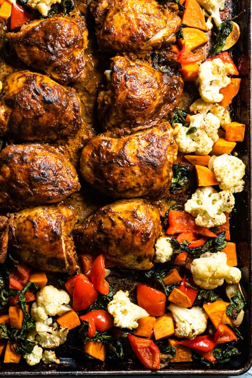 close up of baked curried chicken and vegetables