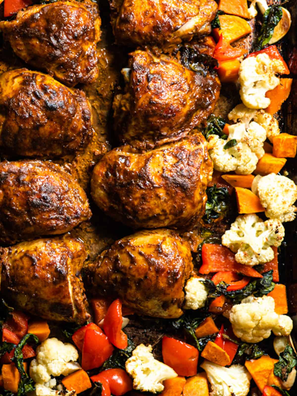 sheet pan curried chicken and vegetables just out of the oven and ready to eat. 