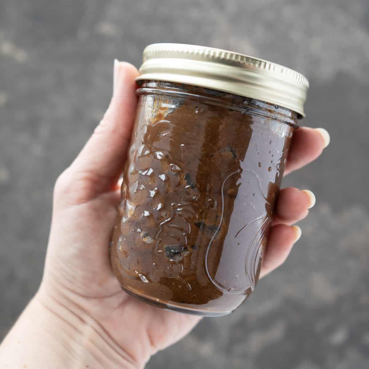 a mason jar full of homemade tamarind paste. 