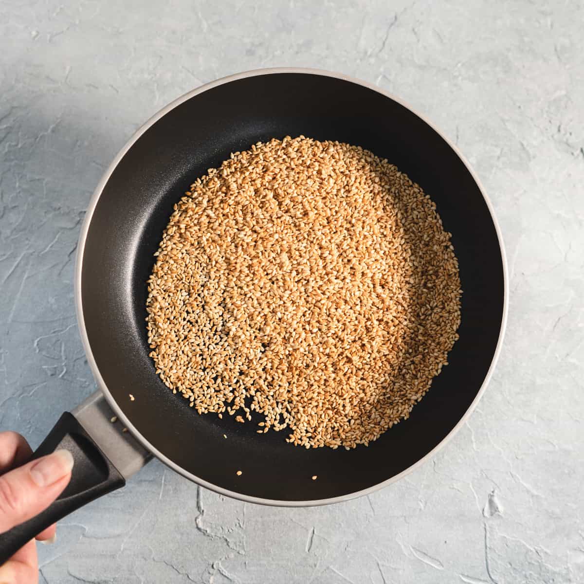 sesame seeds toasted in a saute pan