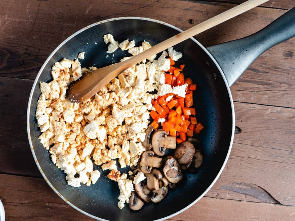 tofu scramble in saute pan before mixing together