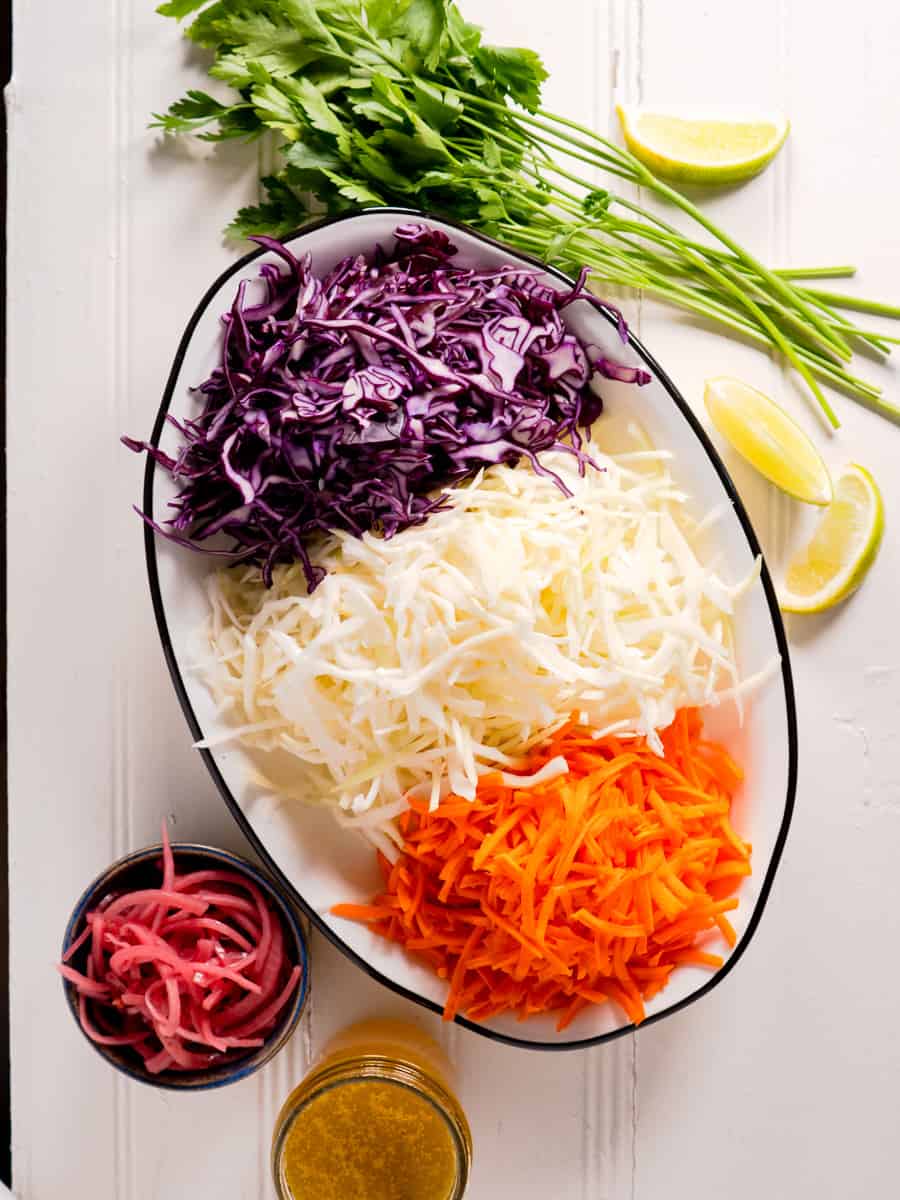 shredded cabbage, carrots and all ingredients for coleslaw