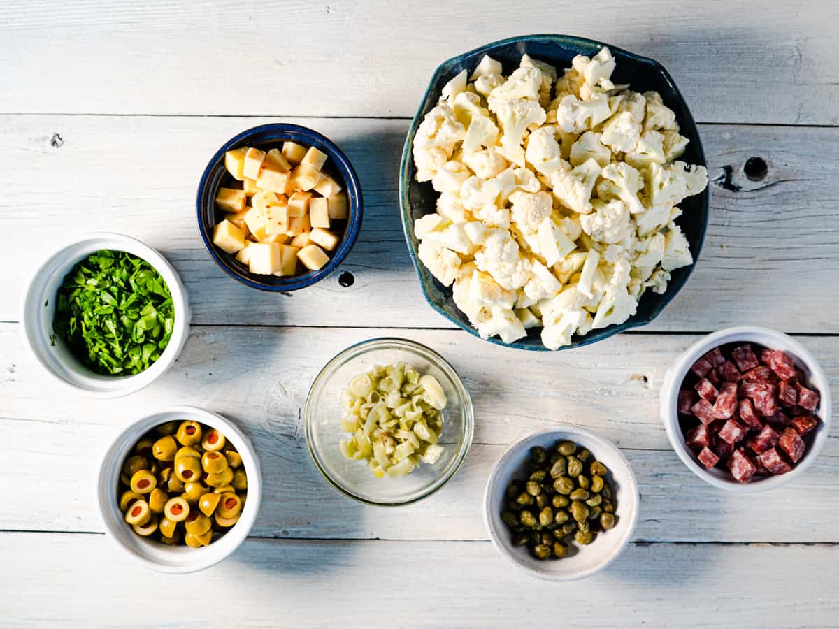 prepared ingredients for cauliflower salad on white background