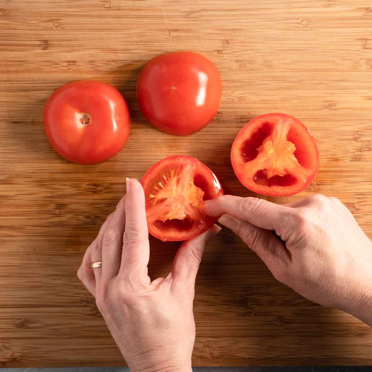 removing seeds from tomatoes.