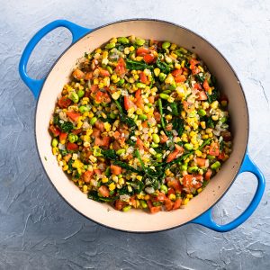 blue dish with prepared colorful summer succotash