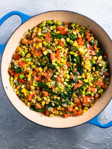 blue dish with prepared colorful summer succotash