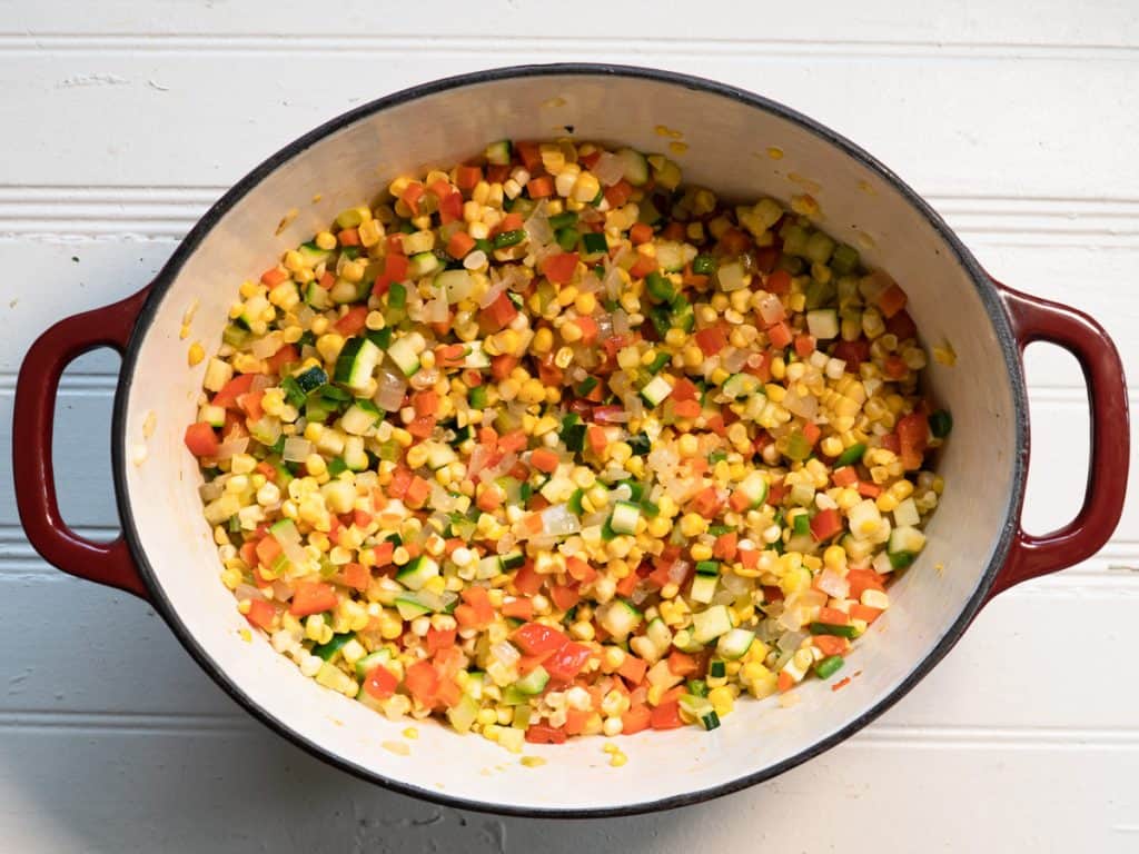 All the cooked vegetables for chowder in oval pot