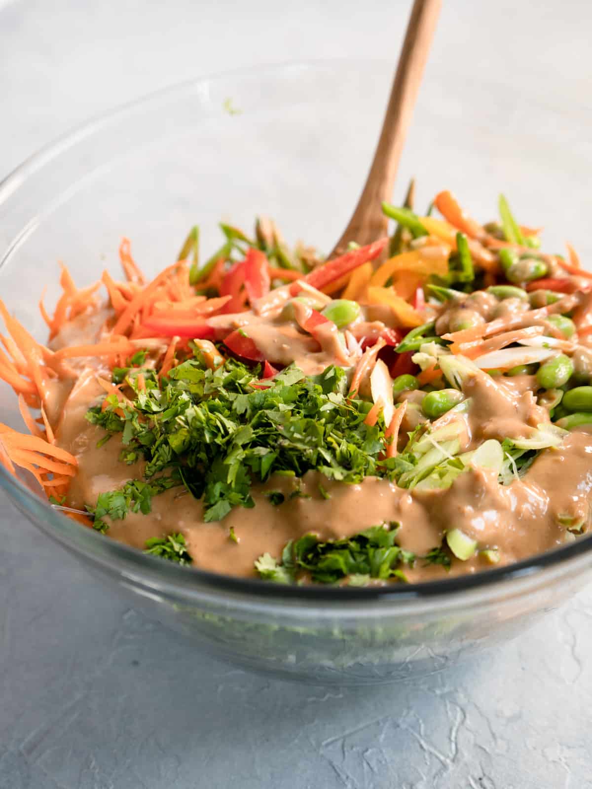 thai slaw in glass bowl before being mixed together.