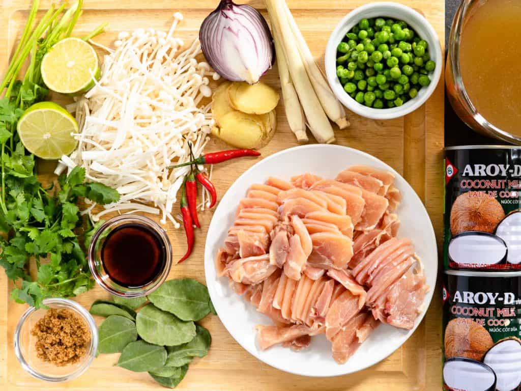 prepared and uncooked ingredients for Thai style coconut chicken soup