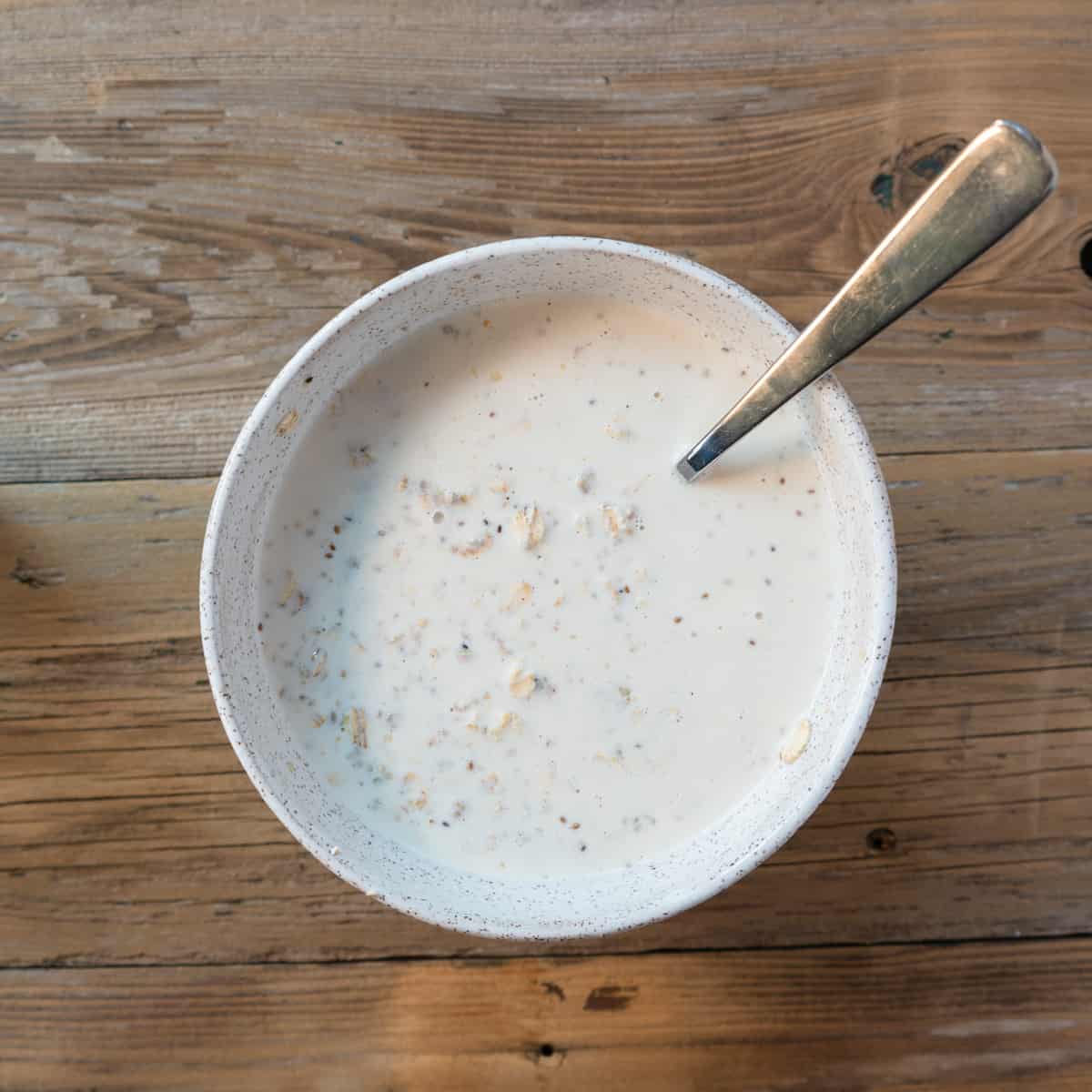 all ingredients mixed together in a bowl with a spoon.