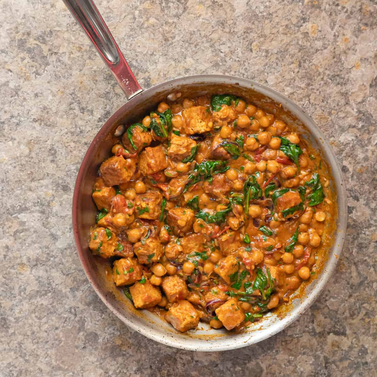 Finished tempeh and chickpea curry in the pan it was cooked in.