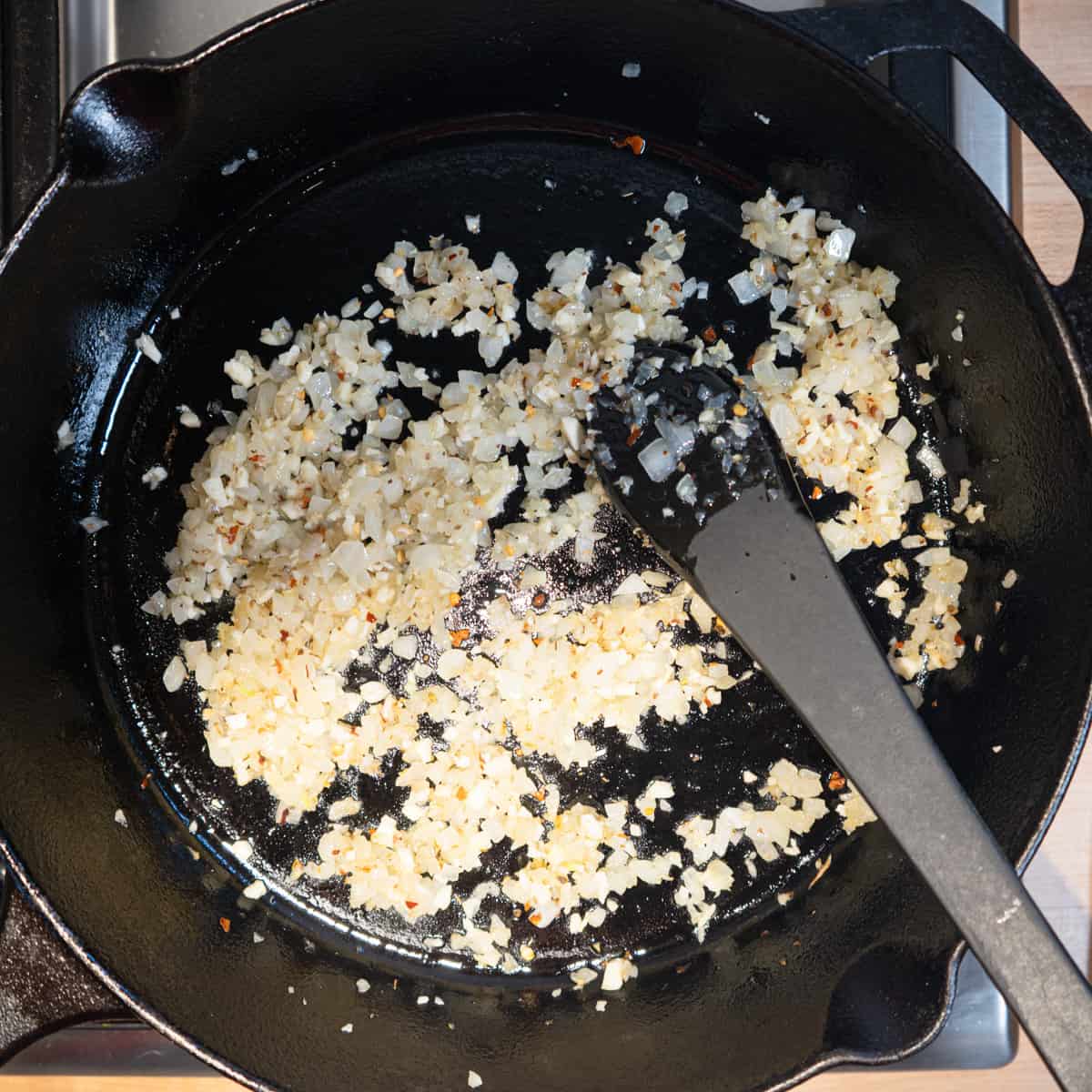 sauteed onions and garlic in cast iron pan