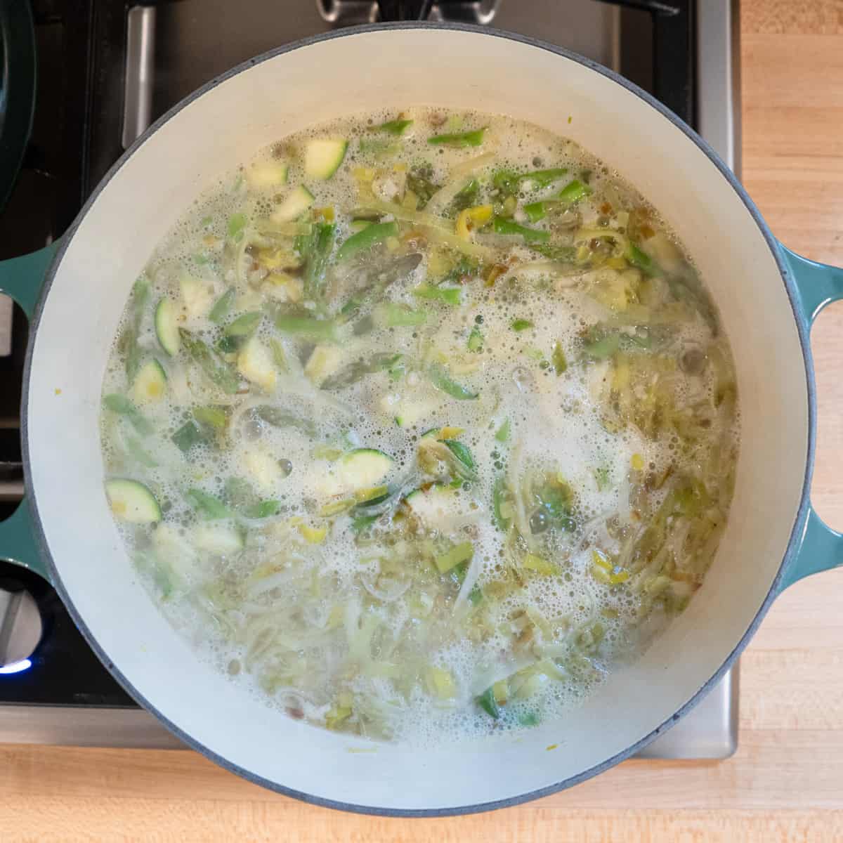 Step 3. Broth is added and the soup is boiling. 