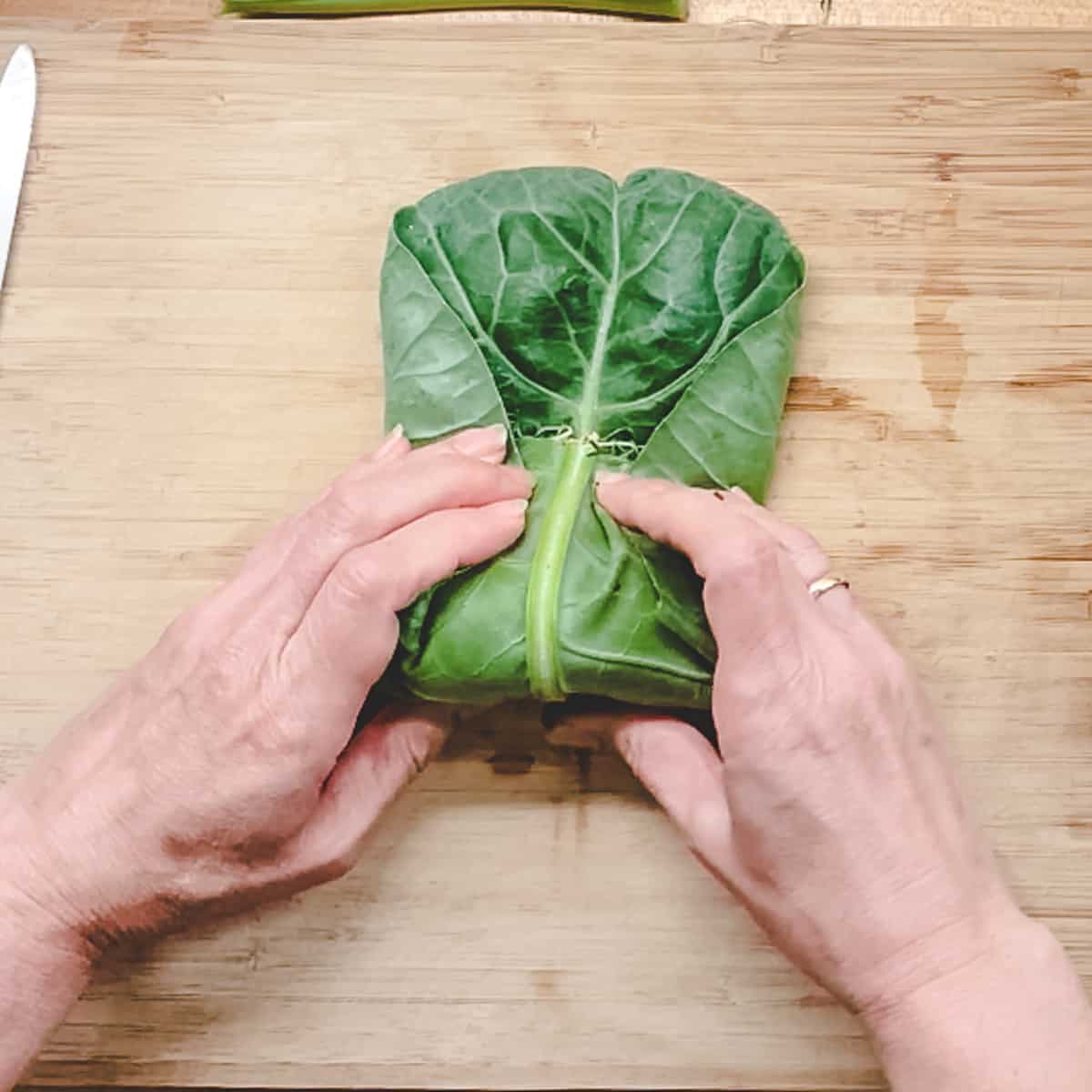 rolling up the leaf with the sides tucked in.