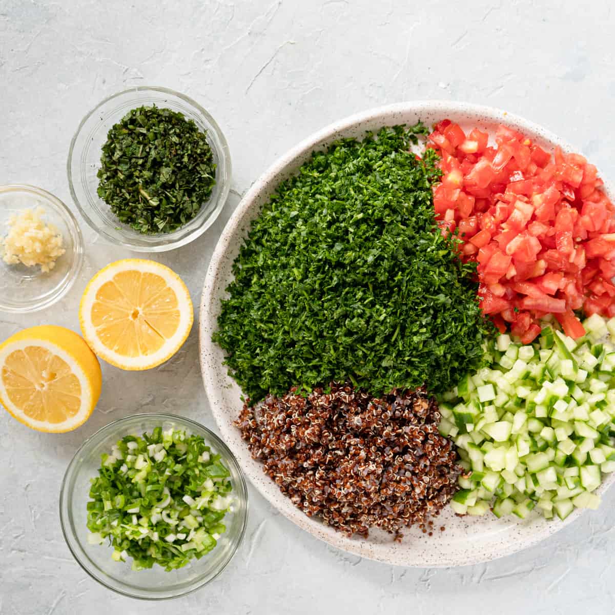 prepared ingredients to make quinoa tabbouleh.