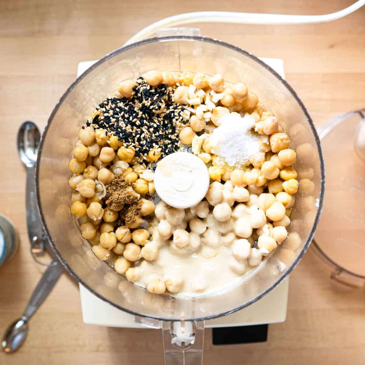 All ingredients for hummus in a food processor before pureeing. 