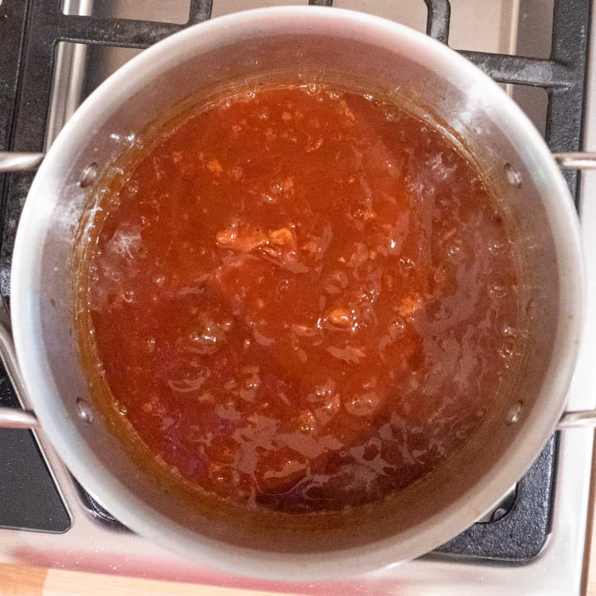 All ingredients for bbq simmering in a saucepan.