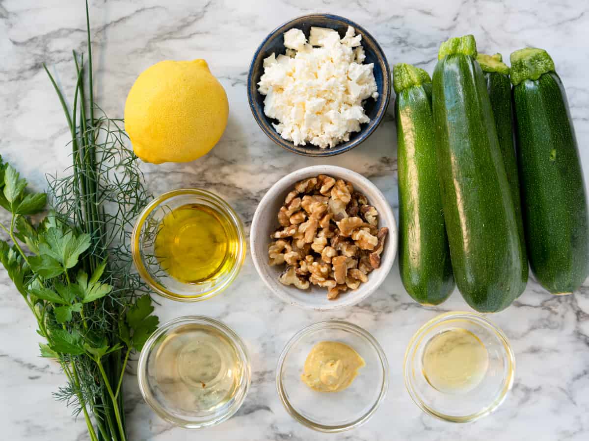all prepared ingredients to make zucchini salad