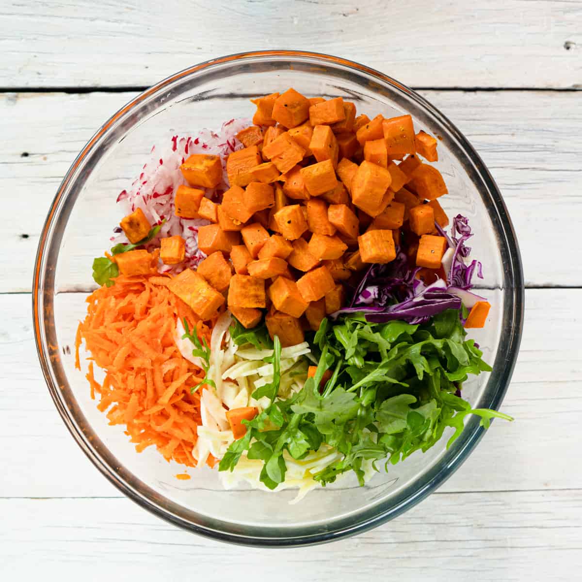 all ingredients in a glass bowl ready to be mixed.