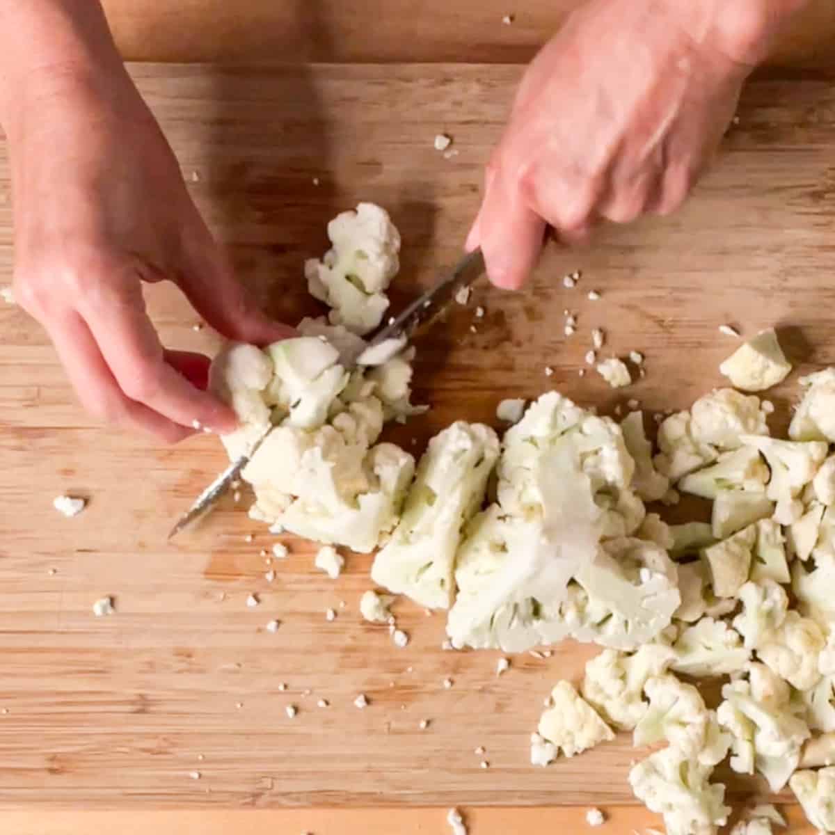 cutting cauliflower into florets.