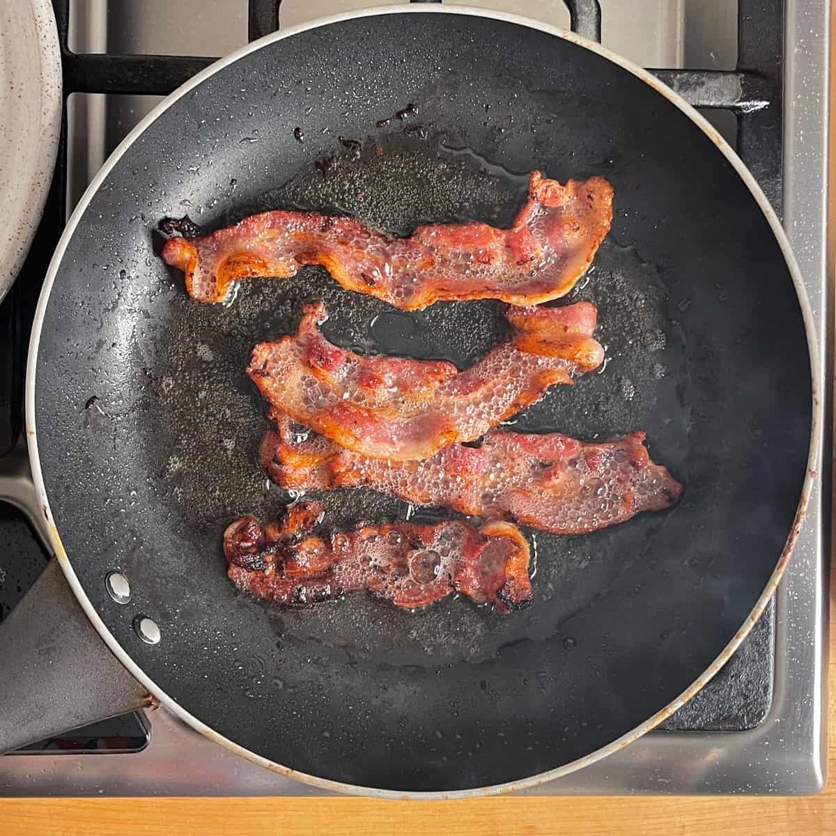 crispy cooked bacon in a non-stick pan. 