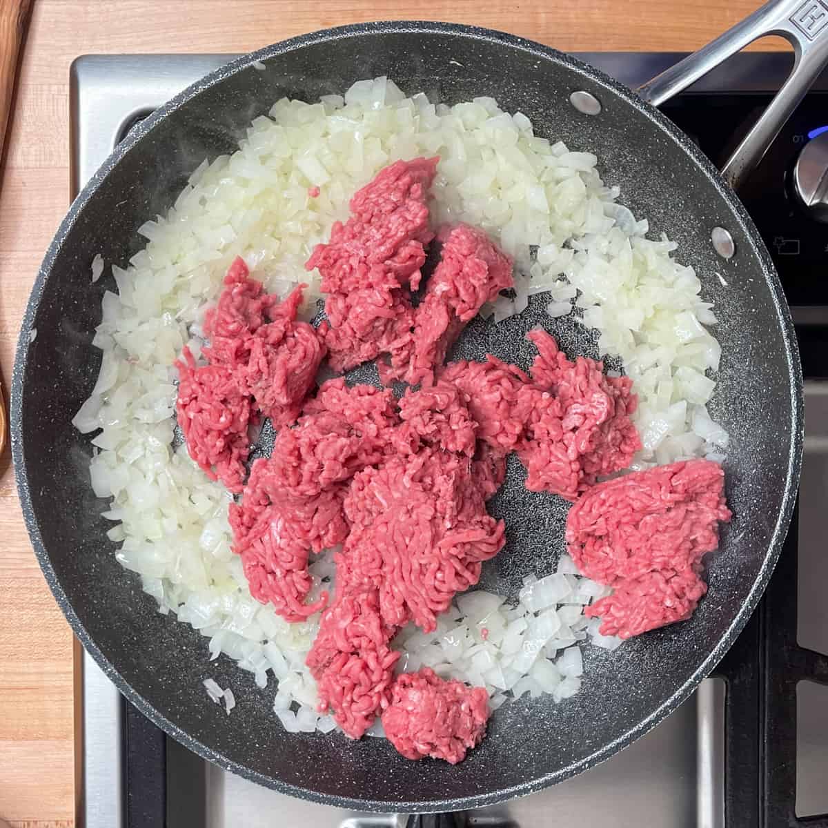 sauteed onions and ground meat in a large skillet.