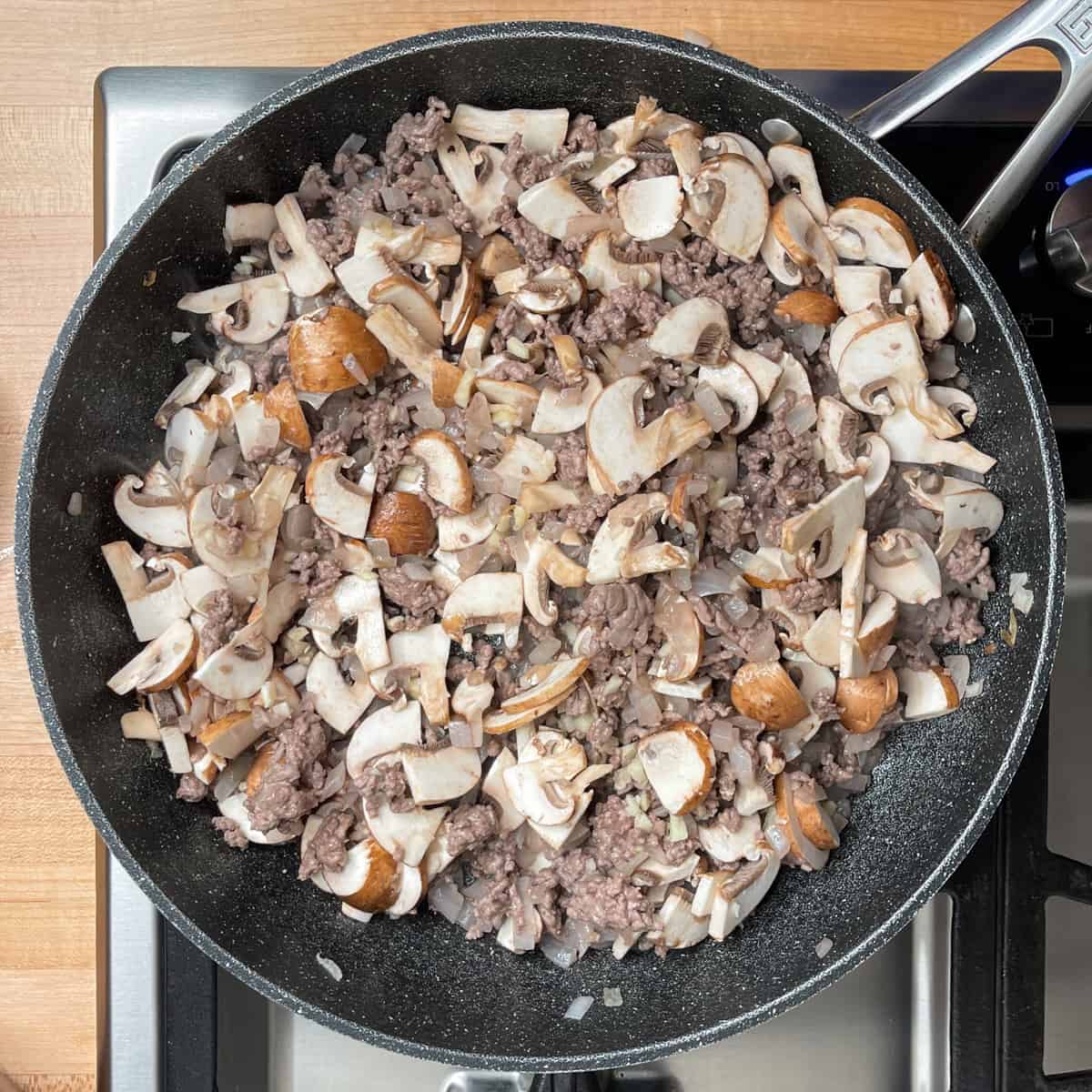 cooked onions, beef and mushrooms in a large skillet.
