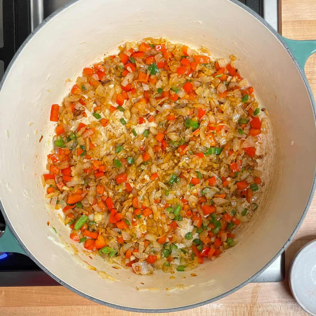 onions sauteed with added red pepper, jalapeno pepper and garlic.