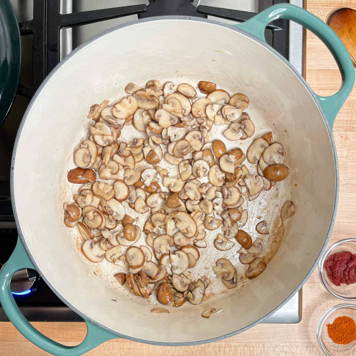 frying the sliced mushrooms in a large soup pot.