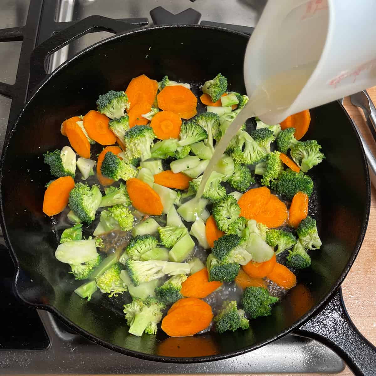 add broth to the broccoli and carrots in cast iron pan. 