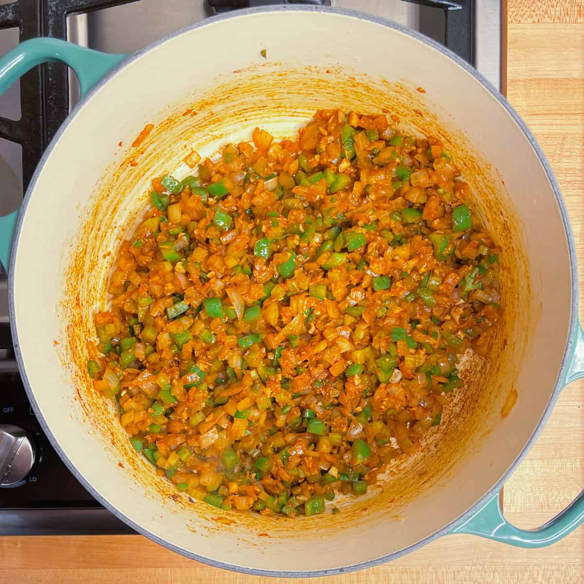 vegetables and spices mixed together in the pot.