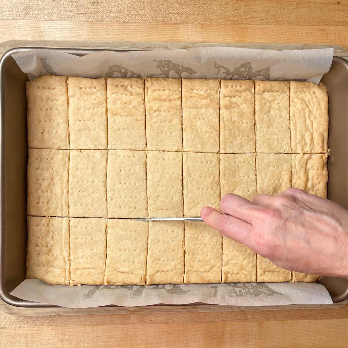 cutting shortbread after baking.