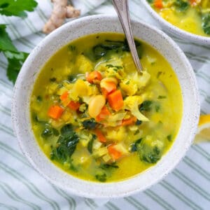 one bowl of detox soup with a spoon.