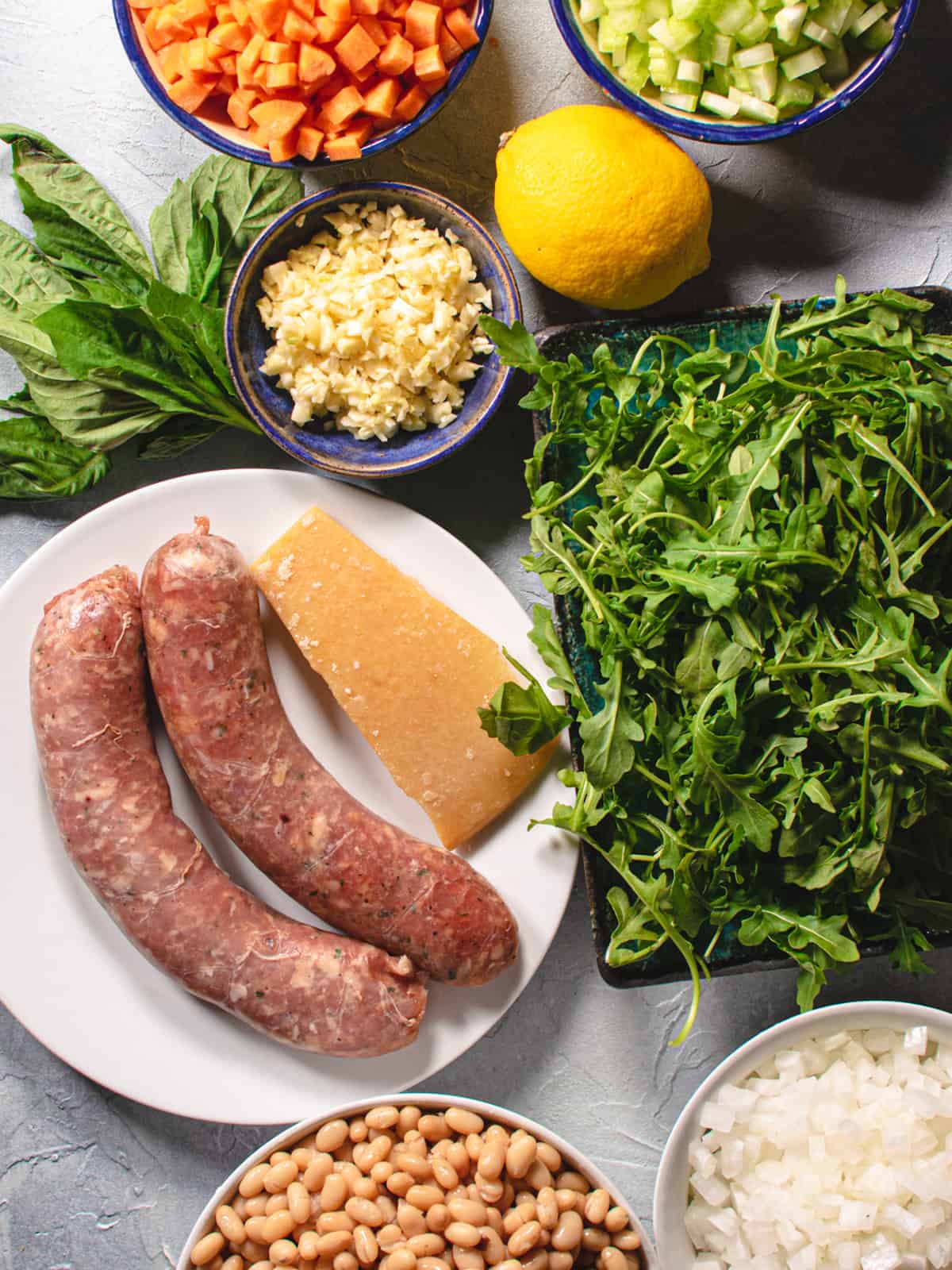 sausage, arugula, garlic, onions, basil, lemon for making soup