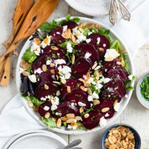 beet and goat cheese salad on a bid of greens.