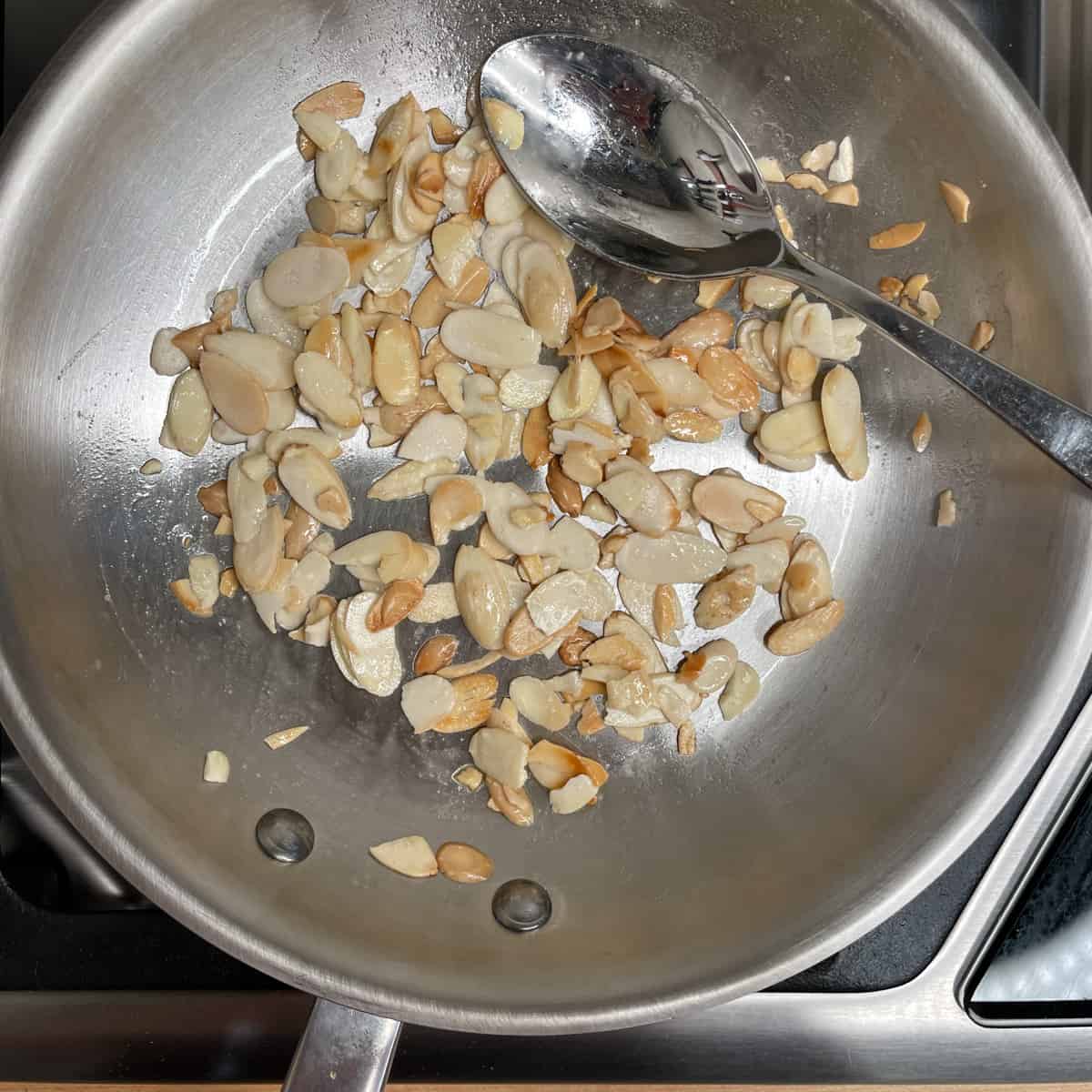 toasting almond slices in a dry pan over low heat until golden brown. 