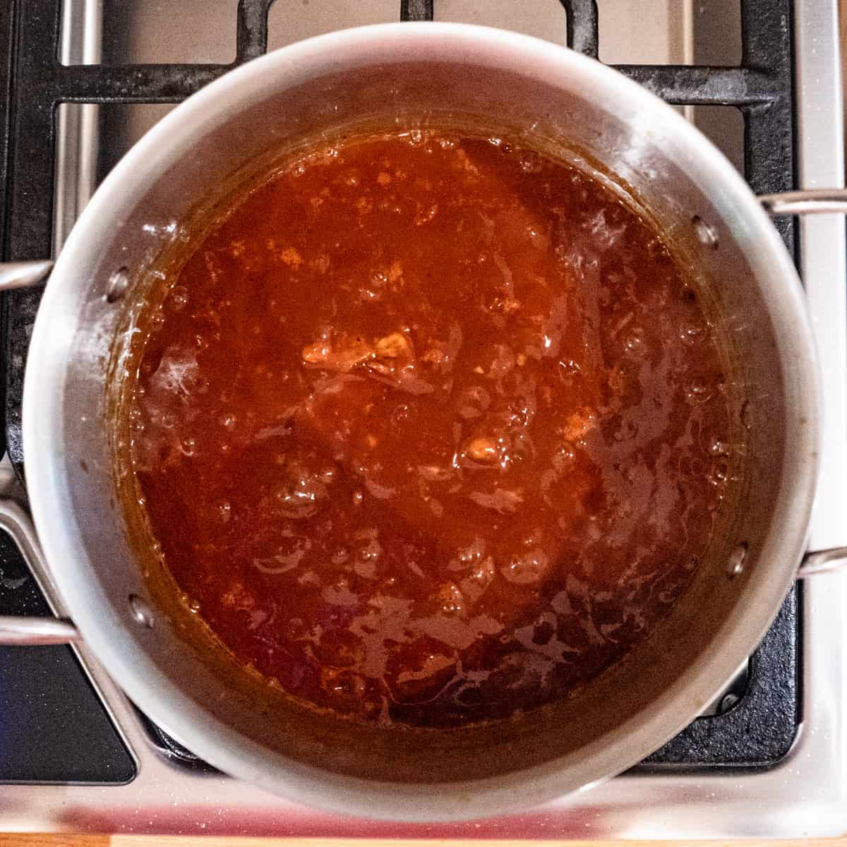 All ingredients for bbq simmering in a saucepan.