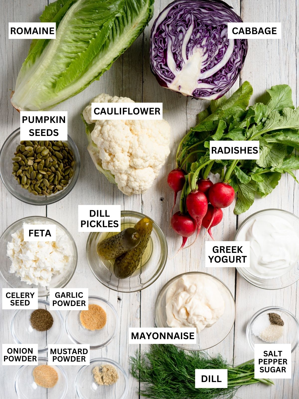 All ingredients needed to make a dill pickle salad laid out and labeled on a white background. 