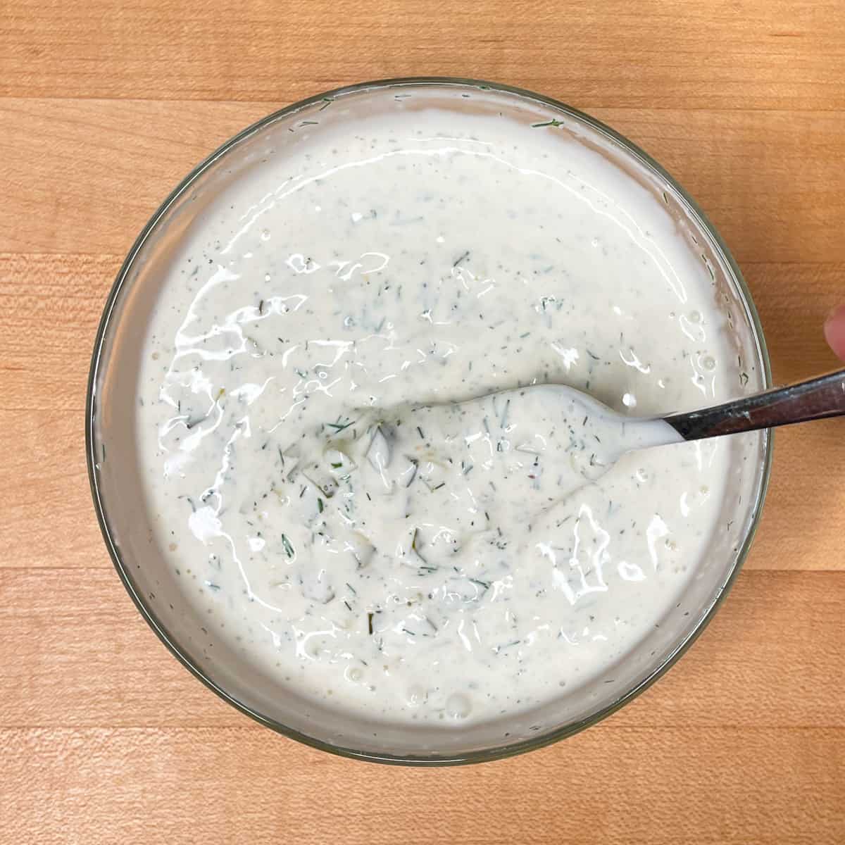 all the dill pickle dressing ingredients mixed together in a bowl. 