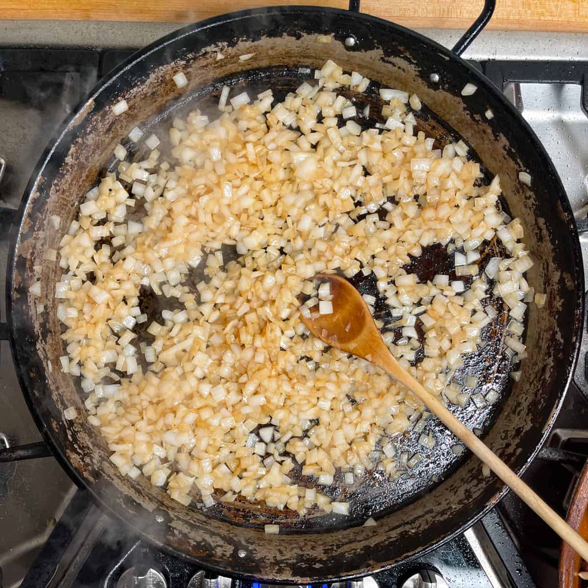 onions lightly browned and sauteed in a paella pan. 