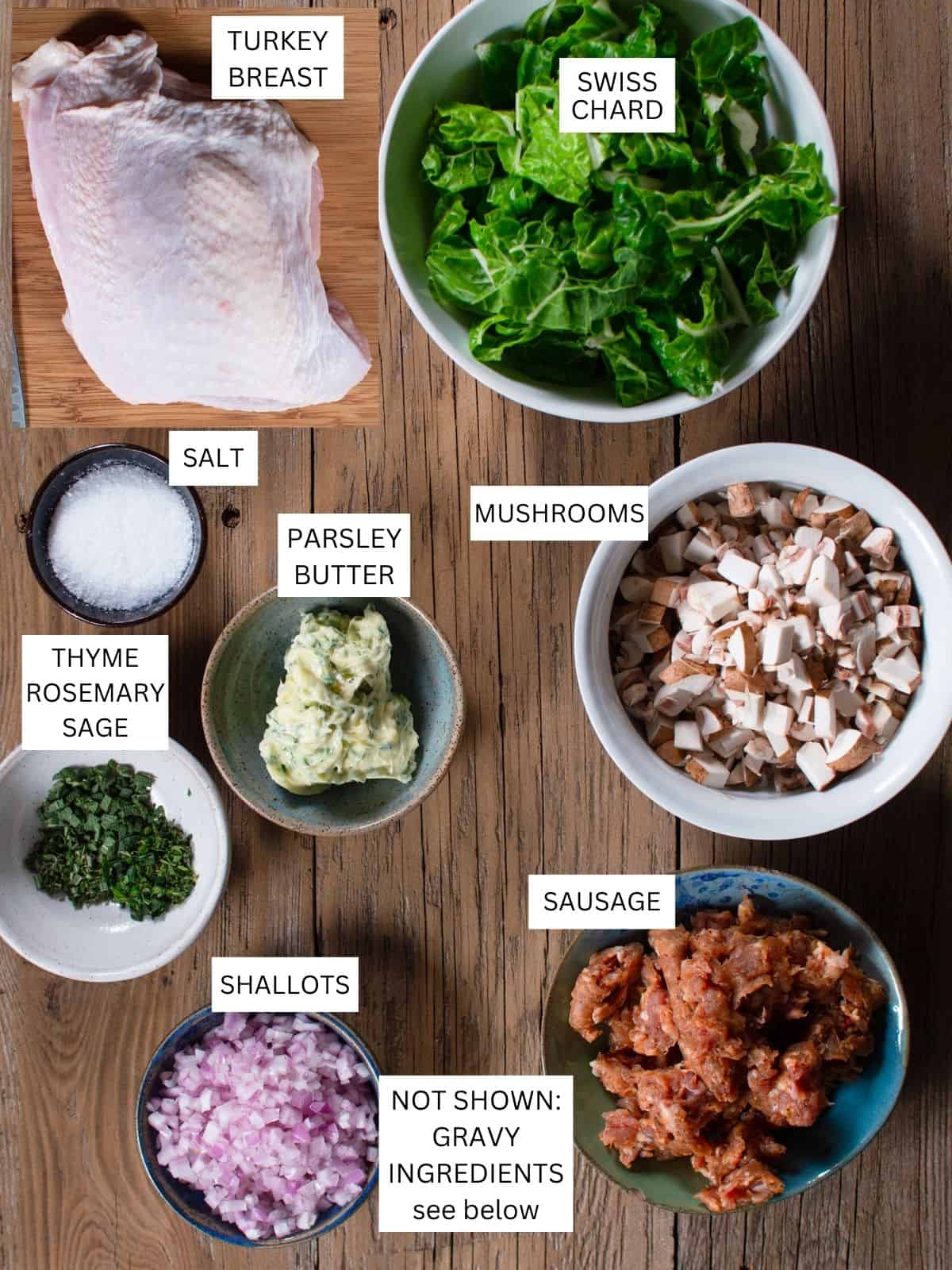 all ingredients to make stuffed turkey breast laid out on a board and labeled. 